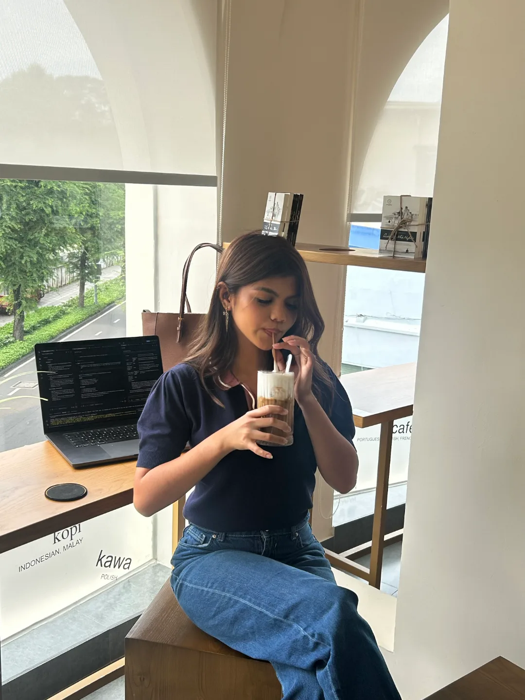 Cercie Florano, founder of SwiftStream, working from a cafe